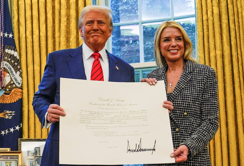 Donald Trump and Pam Bondi pose