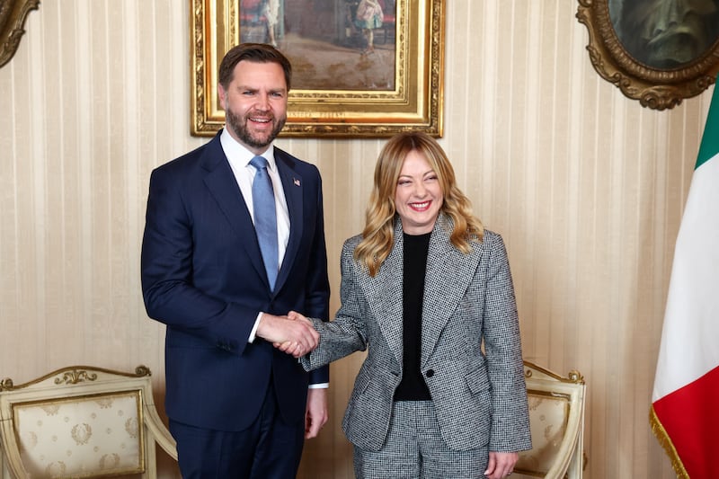 U.S. Vice President JD Vance (L) is welcomed by Italian Prime Minister Giorgia Meloni (R) ahead of their meeting as part of his visit to the Milano Cortina 2026 Winter Olympics in Milan on February 6, 2026.