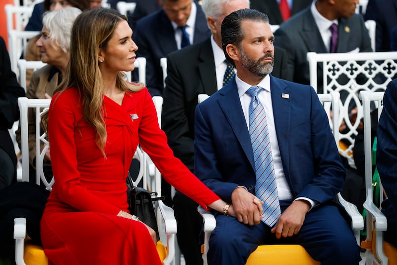 Donald Trump Jr. (R) sits with his girlfriend Bettina Anderson prior to a Presidential Medal of Freedom ceremony in the Rose Garden of the White House on October 14, 2025 in Washington, DC.