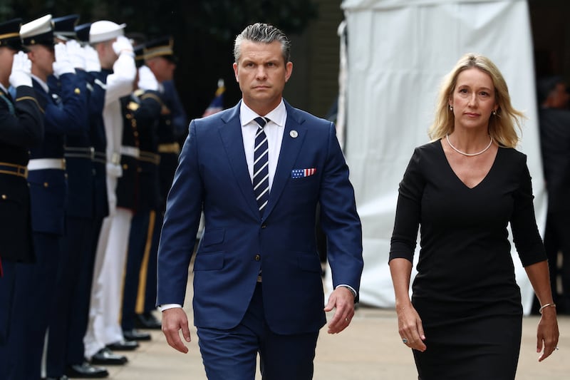 \Defense Secretary Pete Hegseth and his wife, Jennifer Rauchet, walk during a ceremony marking the 24th anniversary of the September 11, 2001, attacks on the United States at the Pentagon, in Washington, D.C., on September 11, 2025.