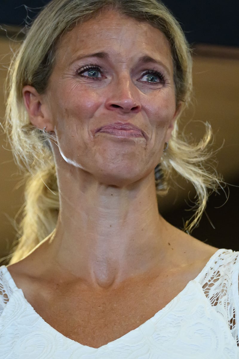 DES MOINES, IOWA - AUGUST 17: Kelly Nunn, the wife of Republican Senator for Iowa Zach Nunn, reacts as she listens to the story of a fallen Iowa soldier on day five of the Iowa State Fair on August 17, 2026 in Des Moines, Iowa. The Iowa State Fair is the largest event in Iowa and one of the oldest and largest agricultural and industrial expositions in the country. (Photo by Leon Neal/Getty Images)
