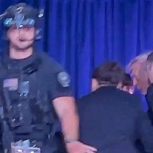 U.S. President Donald Trump is escorted out as a shooter opens fire during the annual White House Correspondents' Association dinner in Washington, D.C., U.S., April 25, 2026, in this screen capture from video. REUTERS/Bo Erickson THIS IMAGE WAS PROCESSED BY REUTERS TO ENHANCE QUALITY, AN UNPROCESSED VERSION HAS BEEN PROVIDED SEPARATELY.
