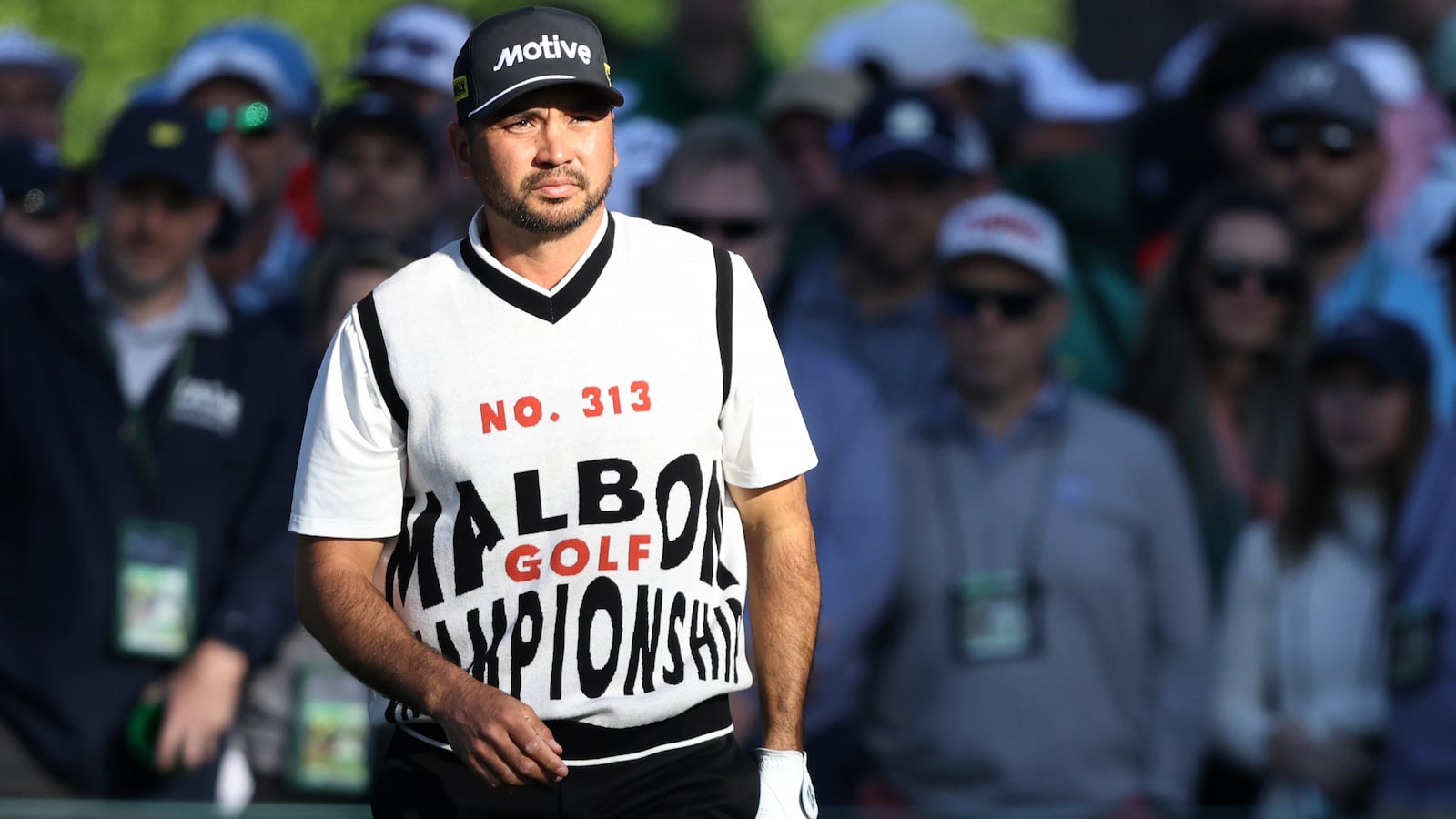 Jason Day leveled up his eclectic grandpa aesthetic at the Masters with a retro vest bearing large red and black letters.