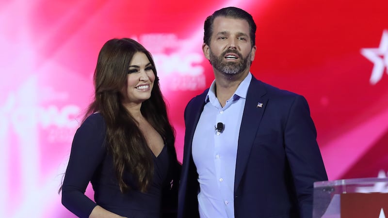 Don Trump Jr. and Kimberly Guilfoyle stand on stage as they address the Conservative Political Action Conference being held in the Hyatt Regency on February 26, 2021 in Orlando, Florida.