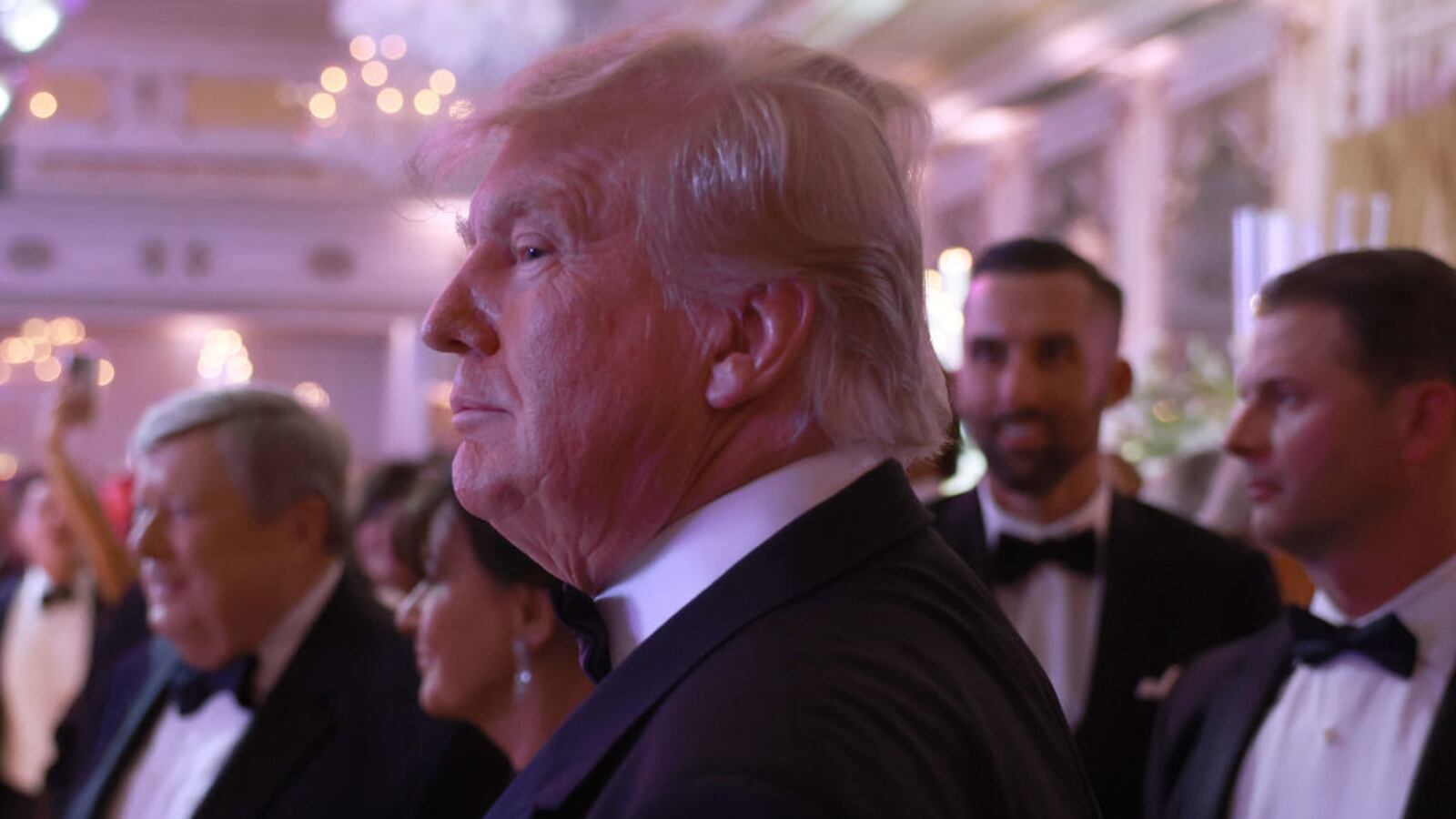 Former U.S. President Donald Trump greets people as he arrives for a New Years event at his Mar-a-Lago home in Palm Beach, Florida.