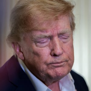 U.S. President Donald Trump speaks to members of the media aboard Air Force One, en route to Joint Base Andrews, Maryland, U.S., following a two-day visit to Ireland, September 13, 2026. REUTERS/Kylie Cooper