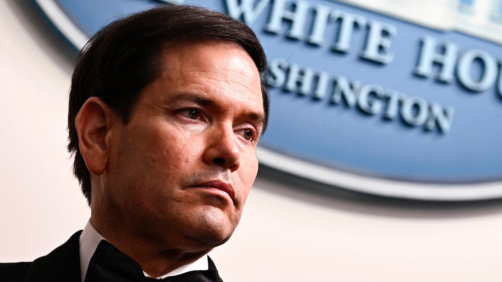 US Secretary of State Marco Rubio listens to US President Donald Trump speak during a press briefing in the Brady Briefing Room at the White House in Washington, DC, shortly after a shooting incident at the White House Correspondents' Dinner on April 25, 2026.