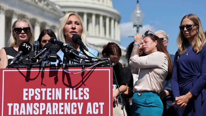 Representative Marjorie Taylor Greene speaks as Haley Robsonn reacts during a press conference to discuss the Epstein Files Transparency bill, directing the release of the remaining files related to the investigations into Jeffrey Epstein and Ghislaine Maxwell, on Capitol Hill in Washington, D.C., U.S., September 3, 2025. REUTERS/Jonathan Ernst