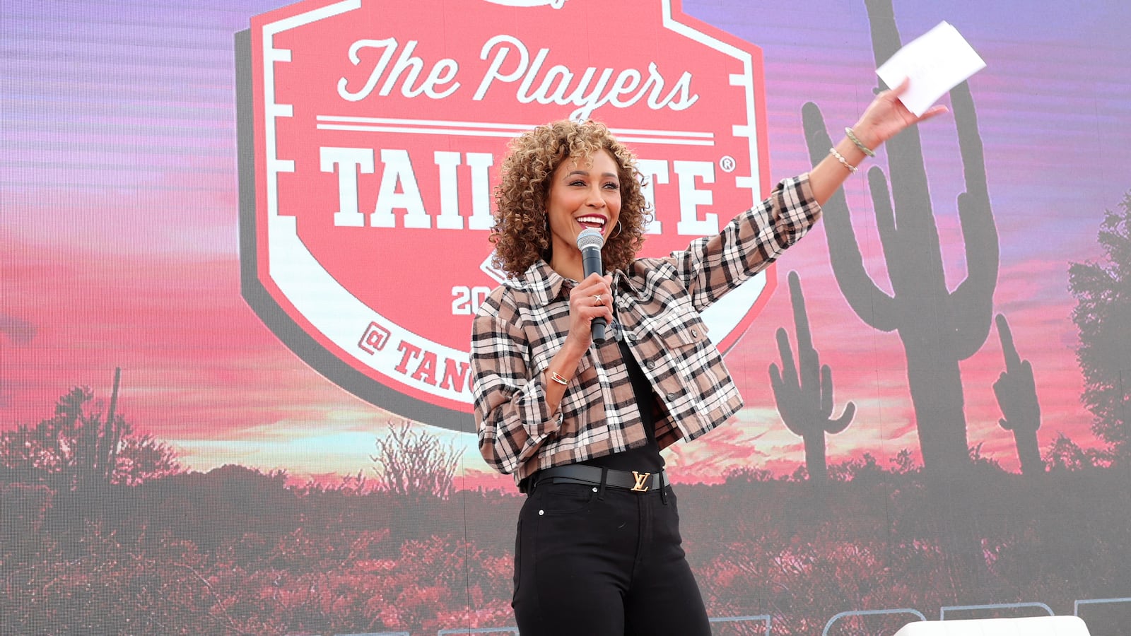 Sage Steele pictured on stage at a 2023 event.