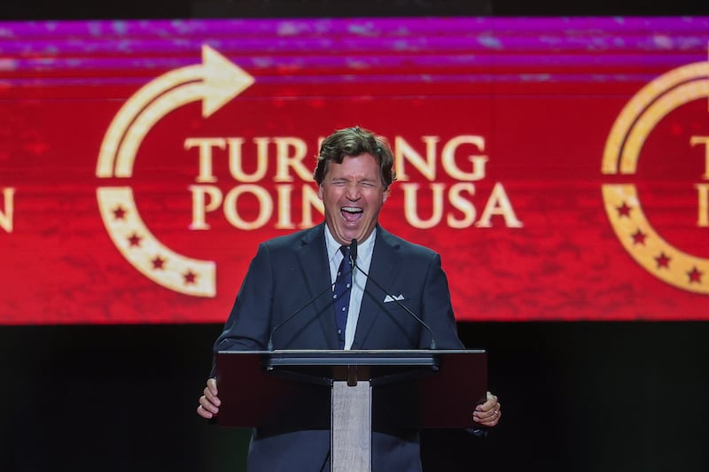 Political commentator Tucker Carlson speaks during the memorial service for political activist Charlie Kirk at State Farm Stadium on September 21,