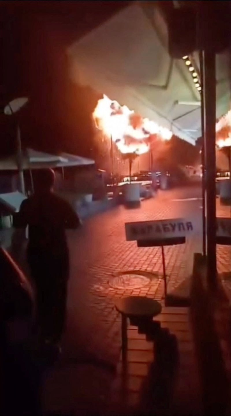 A person watches an explosion during sea drone attacks, amid the Russia-Ukraine conflict, in Sochi, Krasnodar Krai, Russia, September 9, 2026, in this screengrab taken from social media video. Social Media/via REUTERS  THIS IMAGE HAS BEEN SUPPLIED BY A THIRD PARTY. NO RESALES. NO ARCHIVES. NEWS USE ONLY  Verification: - Buildings, store signs and outdoor furniture match archive imagery of the area. - Local officials confirmed there was an attack in Sochi embankment on Wednesday (September 9) - No older versions of the video were found online before September 9.