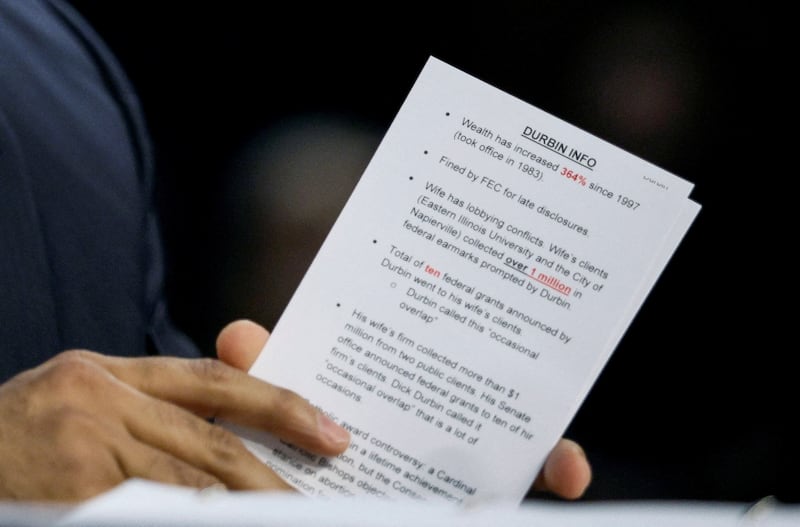 Kash Patel holds a cheat sheet with talking points against the ranking member of the Senate Judiciary Committee, Dick Durbin, ahead of his testimony.