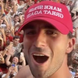Ferran Torres wears 'Make Spain Great Again' hat in celebratory parade on Monday following World Cup win.