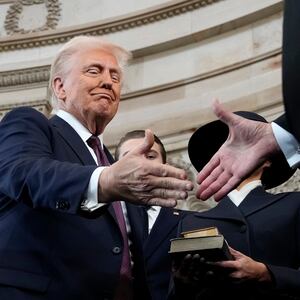 President Donald Trump shakes hands with Chief Justice John Roberts after being sworn in as the 47th president of the United States during inauguration ceremonies in the Rotunda of the U.S. Capitol.