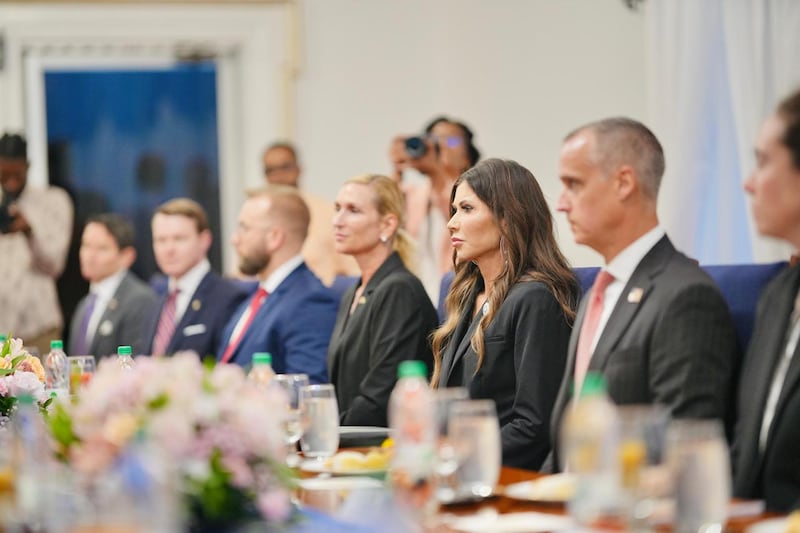 Corey Lewandowski sat next to Kristi Noem.