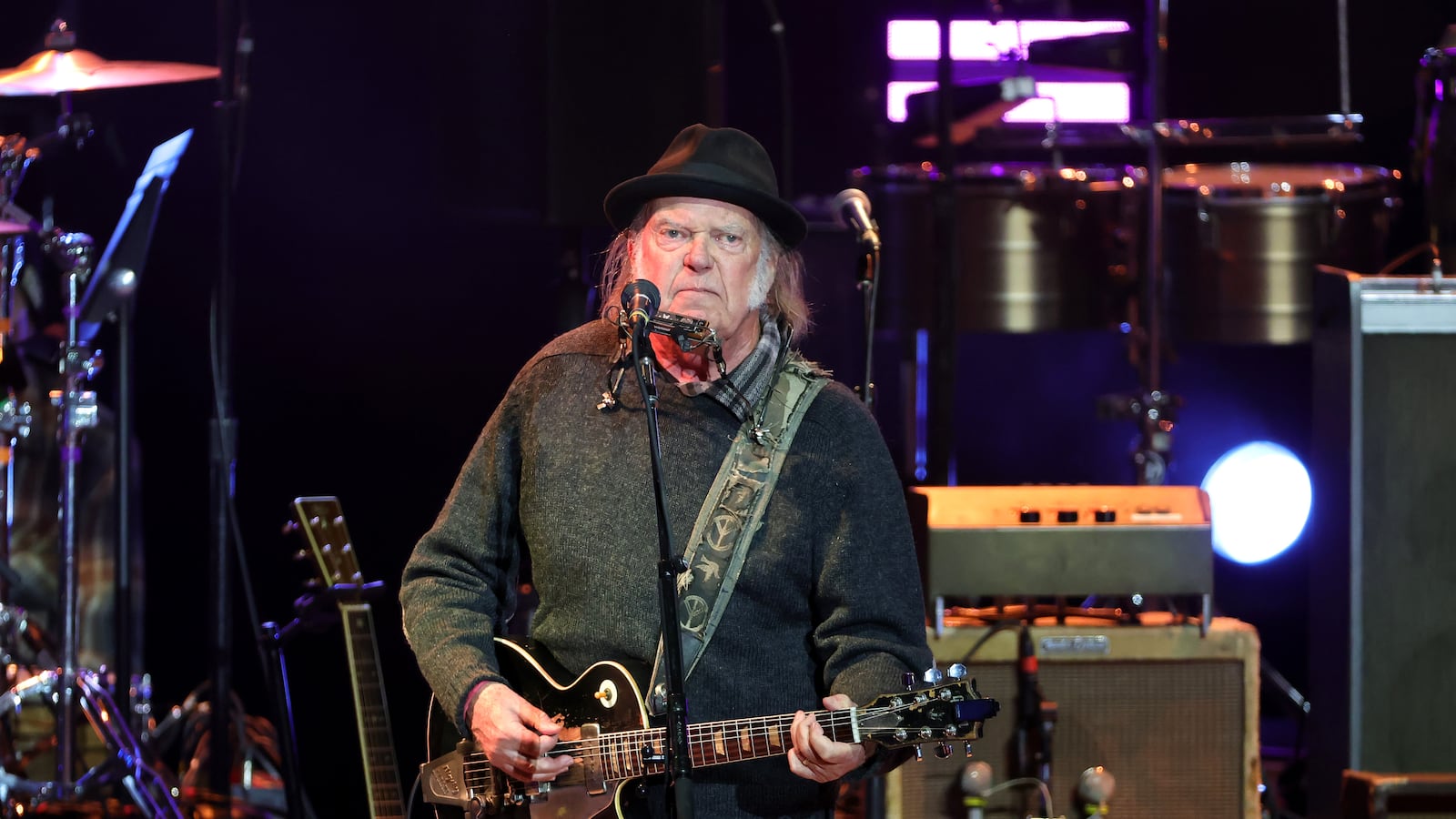 LOS ANGELES, CALIFORNIA - APRIL 26: Neil Young performs onstage during the Light Up The Blues 7 Concert celebrating Autism Speaks' 20th Anniversary at the Greek Theatre on April 26, 2025 in Los Angeles, California. (Photo by Kevin Winter/Getty Images)