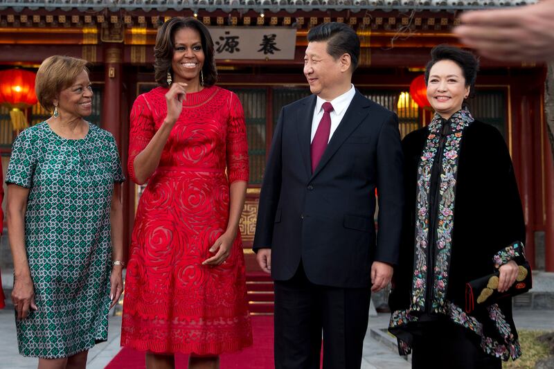 articles/2014/03/21/michelle-obama-s-china-tour-looks-stella-mccartney-designs-a-maleficent-line-for-kids/140321-mobama-dress-china_swvkiu