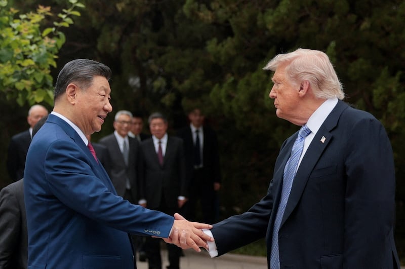 Trump shakes hands with Chinese President Xi Jinping