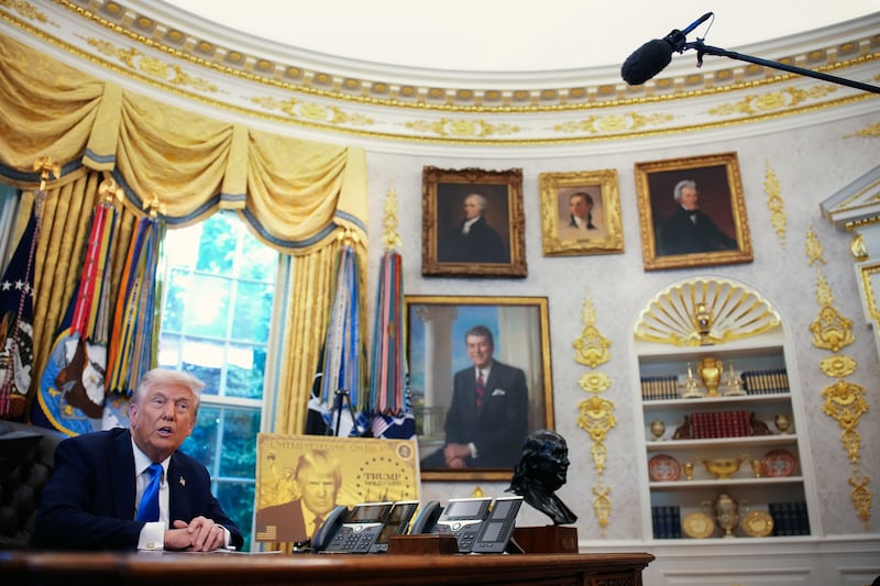 WASHINGTON, DC - SEPTEMBER 19: President Donald Trump delivers remarks alongside a poster of the "Trump Gold Card" before signing an executive order in the Oval Office at the White House on September 19, 2025 in Washington, DC. The "Trump Gold Card" is a visa that allows foreign nationals permanent residency and a pathway to U.S. citizenship for a $1 million investment in the United States. (Photo by Andrew Harnik/Getty Images)