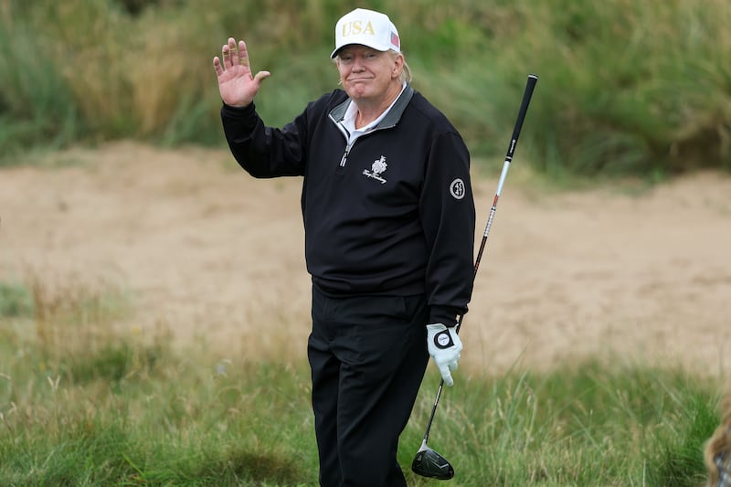 BALMEDIE, SCOTLAND - JULY 29: U.S. President Donald Trump holds a driver after teeing off during the opening of his new golf course at his Trump International Golf links resort on July 29, 2025 in Balmedie, Scotland. President Trump is visiting Scotland in a trip that’s part-vacation, part-work, as he stayed at his Trump Turnberry golf course, followed by Trump International Golf Links in Aberdeenshire, between July 25 to 29. (Photo by Jeff J Mitchell/Getty Images)