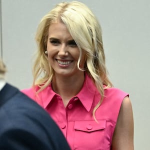 Natalie Harp, aide to US President Donald Trump, looks on as President Trump visits the Mission Control Center at NASA Lyndon B. Johnson Space Center in Houston, Texas, on August 28, 2026.