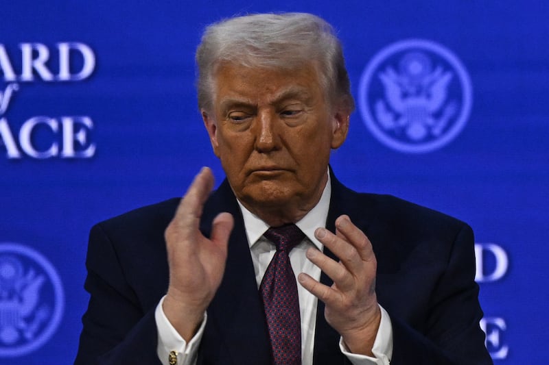 A bruise is seen on the top of the US President Donald Trump's left hand as he attends the signing ceremony of the Peace Charter for Gaza as part of the 56th World Economic Forum in Davos, Switzerland on January 22.