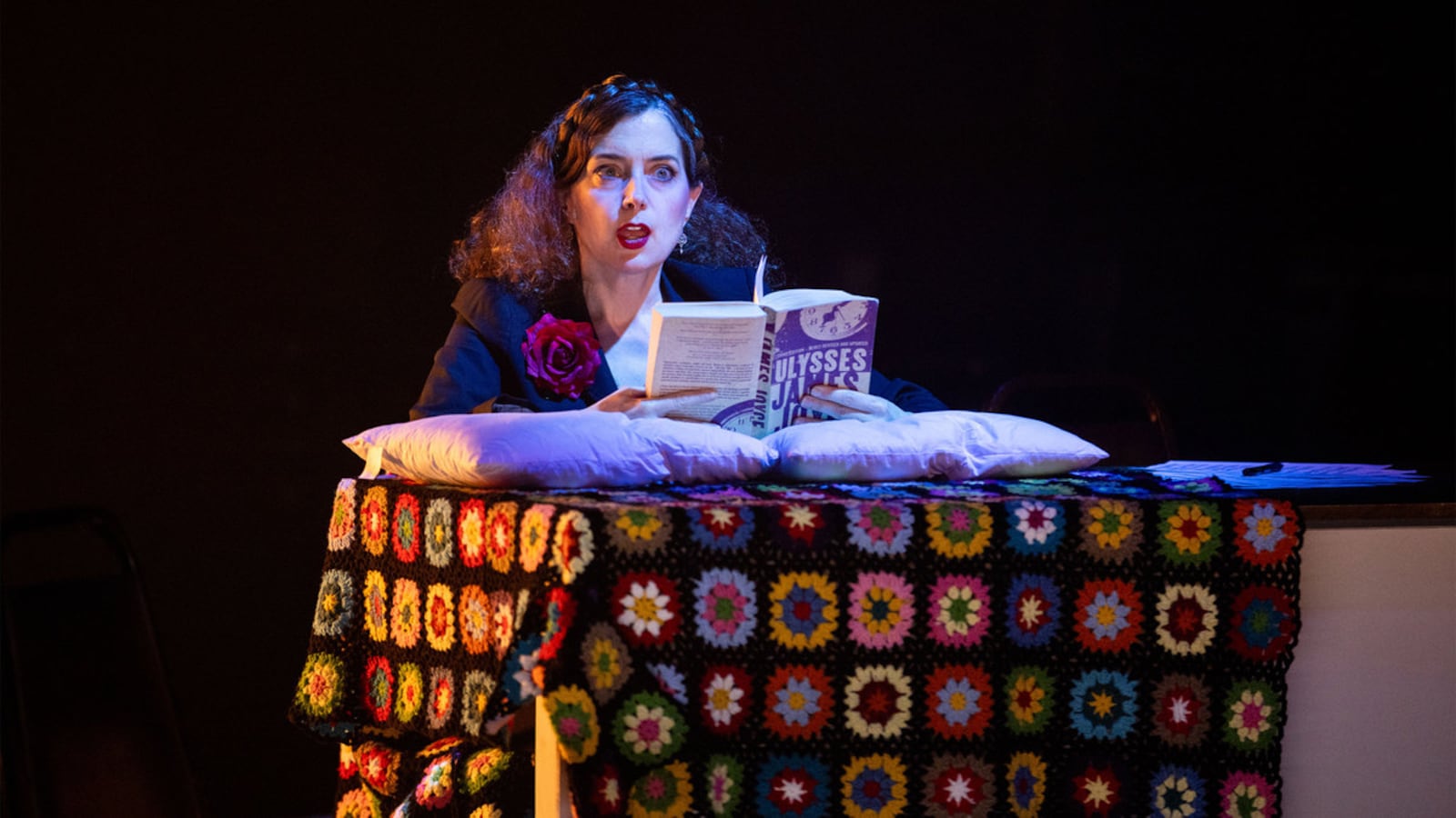 Scott Shepherd holds his arms out on stage