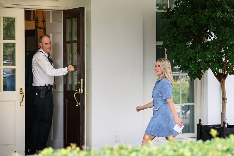 Karoline Leavitt walks into the West Wing after television interviews at the White House in Washington, DC on August 14, 2025.
