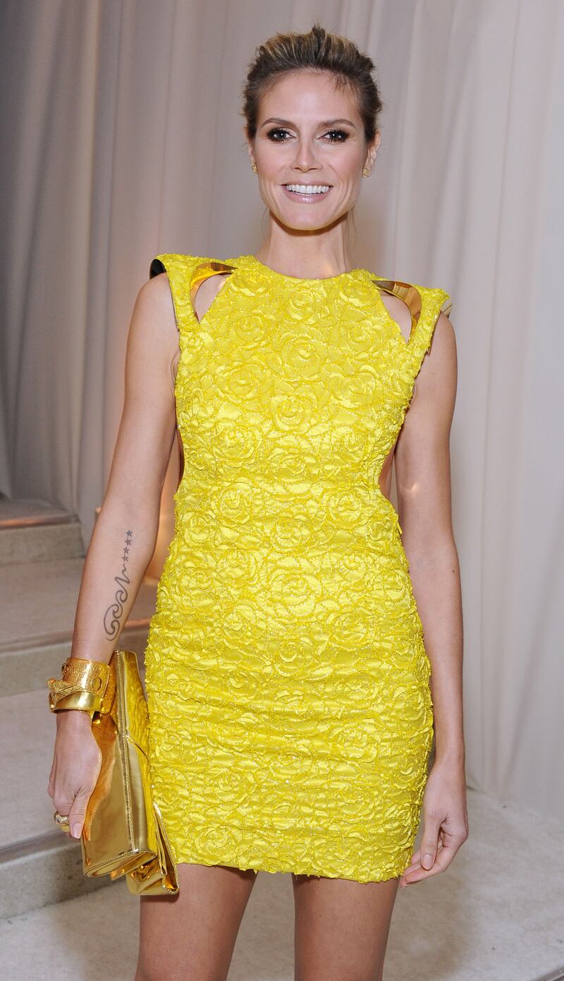 galleries/2012/09/05/kate-moss-to-gisele-bundchen-tattoos-guess-the-model-s-tattoos-photos/model-tattoos-klum-far_miuxsm