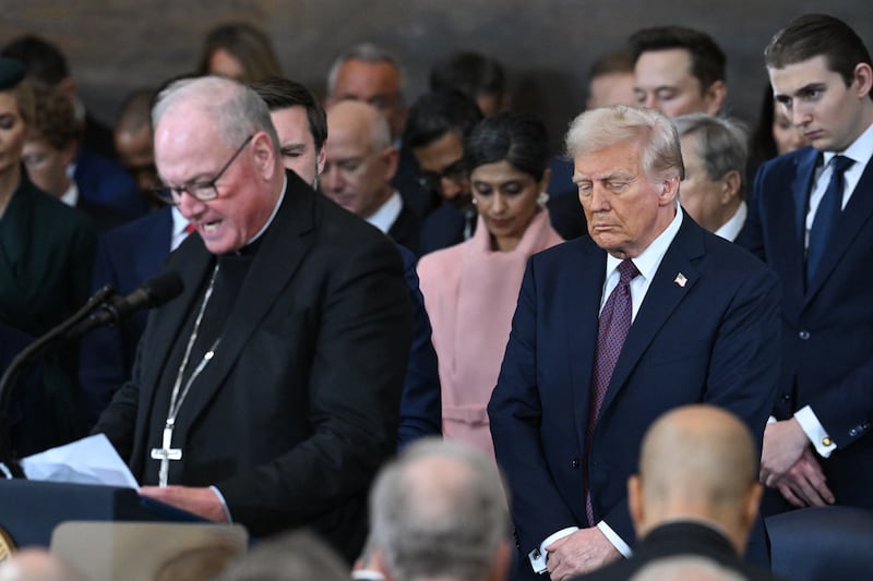 Archbishop of New York Cardinal Timothy Dolan (L) delivers the invocation during the inauguration ceremony before Donald Trump (C) is sworn in as the 47th US President in the Capitol Rotunda in Washington, DC, on January 20, 2025.