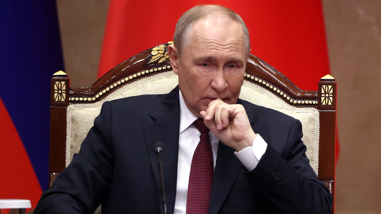 BISHKEK, KYRGYZSTAN - NOVEMBER 26: Russian President Vladimir Putin grimaces during a signing ceremony at the Yntymak Ordo Presidential Palace, on November 26, 2025 in Bishkek, Kyrgyzstan. Vladimir Putin makes a three-day state visit to the Kyrgyz Republic. During his stay he takes part in a regular session of the Collective Security Council of the Collective Security Treaty Organisation (CSTO). Putin will also hold talks with President of Kyrgyzstan Sadyr Japarov to discuss development of the strategic partnership and allied relationship between Russia and Kyrgyzstan. (Photo by Contributor/Getty Images)