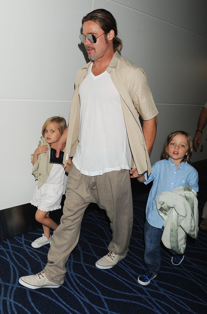 Brad Pitt, Knox Jolie-Pitt and Vivienne Jolie-Pitt are seen on July 30, 2013, in Tokyo, Japan.