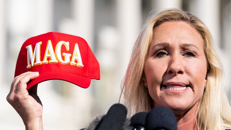 WASHINGTON - MAY 1: Rep. Marjorie Taylor Greene, R-Ga., holds her "Make America Great Again" hat during the news conference outside the U.S. Capitol on Wednesday, May 1, 2024, announcing she will move forward next week on the motion to vacate Speaker Mike Johnson.