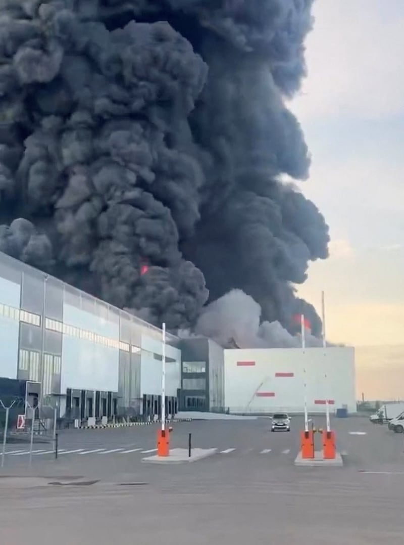 Smoke rises from Wildberries facility, from what the Ukrainian authorities say was following a drone attack, in Shushary, Pushkinsky District, St. Petersburg, Russia July 24, 2026 in this screen grab taken from a social media video. SOCIAL MEDIA/via REUTERS  THIS IMAGE HAS BEEN SUPPLIED BY A THIRD PARTY. NO RESALES. NO ARCHIVES.  VERIFICATION: Reuters confirmed the location as Pushkinsky District, St. Petersburg, Russia from the warehouse structures, buildings and road signage which matched archive and satellite imagery. Coordinates: 59.78415378515624, 30.445248768134785. Tatyana Kim, the co-founder and head of Wildberries, posted on Telegram that logistics sites in St. Petersburg had been attacked on July 24 NASA FIRMS detected thermal activities in the morning of July 24 in the area. No older versions of the video could be found online before July 24, 2026.