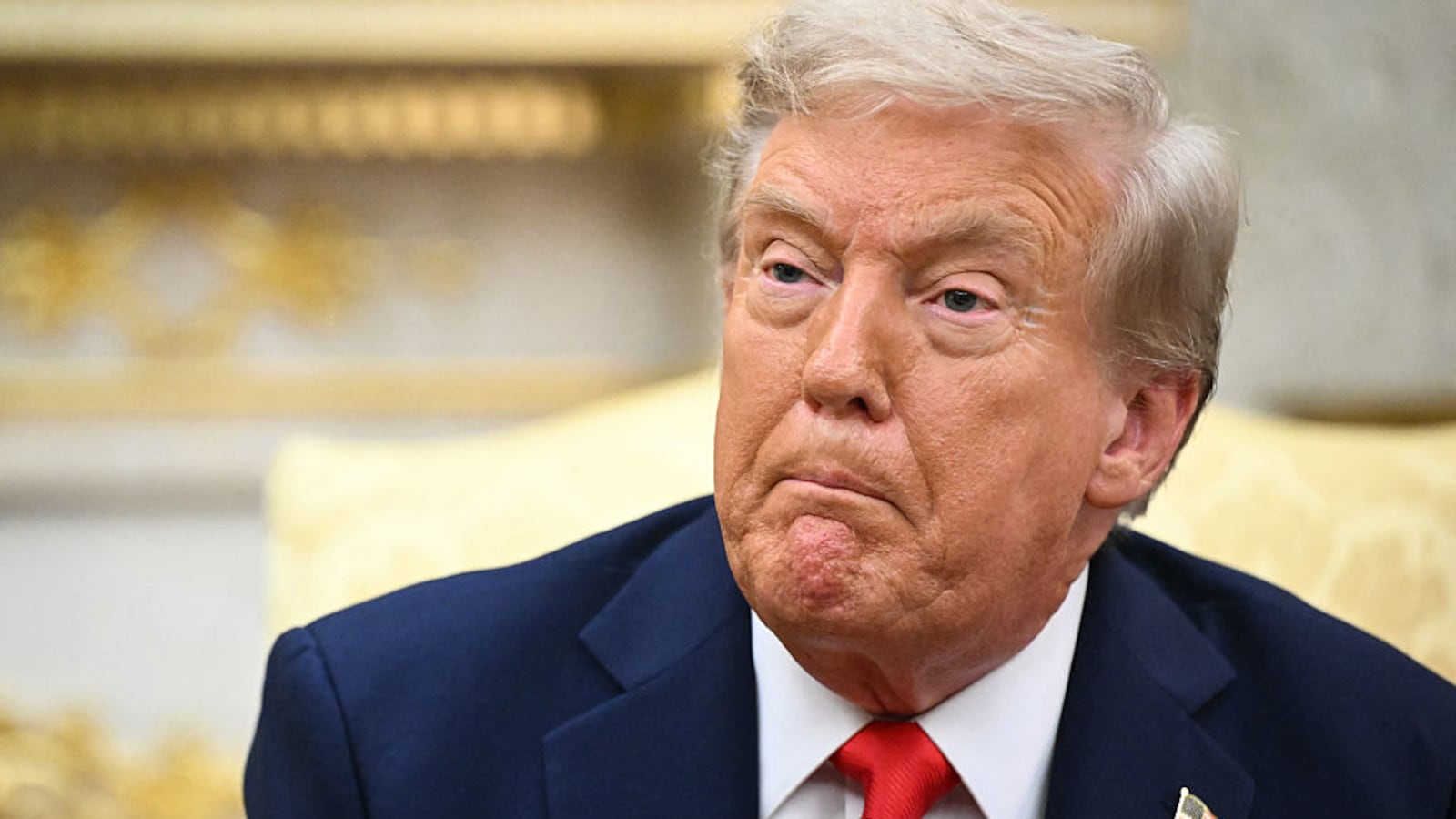 US President Donald Trump looks on during a meeting with Ukrainian President Volodymyr Zelensky in the Oval Office of the White House in Washington, DC, on August 18, 2025.