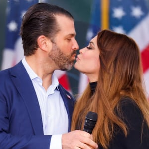 U.S. President Donald Trump's son Donald Trump Jr. and his girlfriend Kimberly Guilfoyle kiss as supporters of U.S. President Donald Trump gather by the White House ahead of Trump's speech to contest the certification by the U.S. Congress of the results of the 2020 U.S. presidential election in Washington, U.S, January 6, 2021.