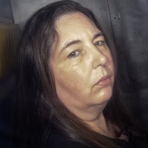 TOPSHOT - This picture taken on May 12, 2025 shows Erin Patterson arriving in the back of a prison transport vehicle at Latrobe Valley Magistrate's Court in Morwell, Australia. An Australian woman murdered her husband's parents and aunt by lacing their beef Wellington lunch with toxic mushrooms, a jury found on July 7 at the climax of a trial watched around the world. Keen home cook Erin Patterson hosted an intimate meal in July 2023 that started with good-natured banter and earnest prayer -- but ended with three guests dead. (Photo by Martin KEEP / AFP) / For any use in Australia and New Zealand, please contact the AFP sales department at sydsales@afp.com or +61 405 149 534. (Photo by MARTIN KEEP/AFP via Getty Images)