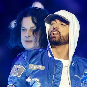 Eminem and Jack White perform during halftime of a Thanksgiving NFL football game between the Detroit Lions and the Green Bay Packers at Ford Field