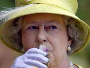 Queen Elizabeth II takes a sip of wine during a wine country tour in Adelaide, February 28, 2002.
