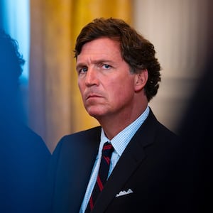 Tucker Carlson sitting down