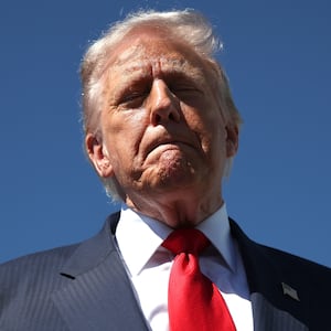 WEST PALM BEACH, FLORIDA - OCTOBER 31: US President Donald Trump speaks to reporters as he arrives at Palm Beach International Airport on October 31, 2025 in West Palm Beach, Florida. Trump is spending the weekend at his Mar-A-Lago estate in Palm Beach, Florida. (Photo by Samuel Corum/Getty Images)
