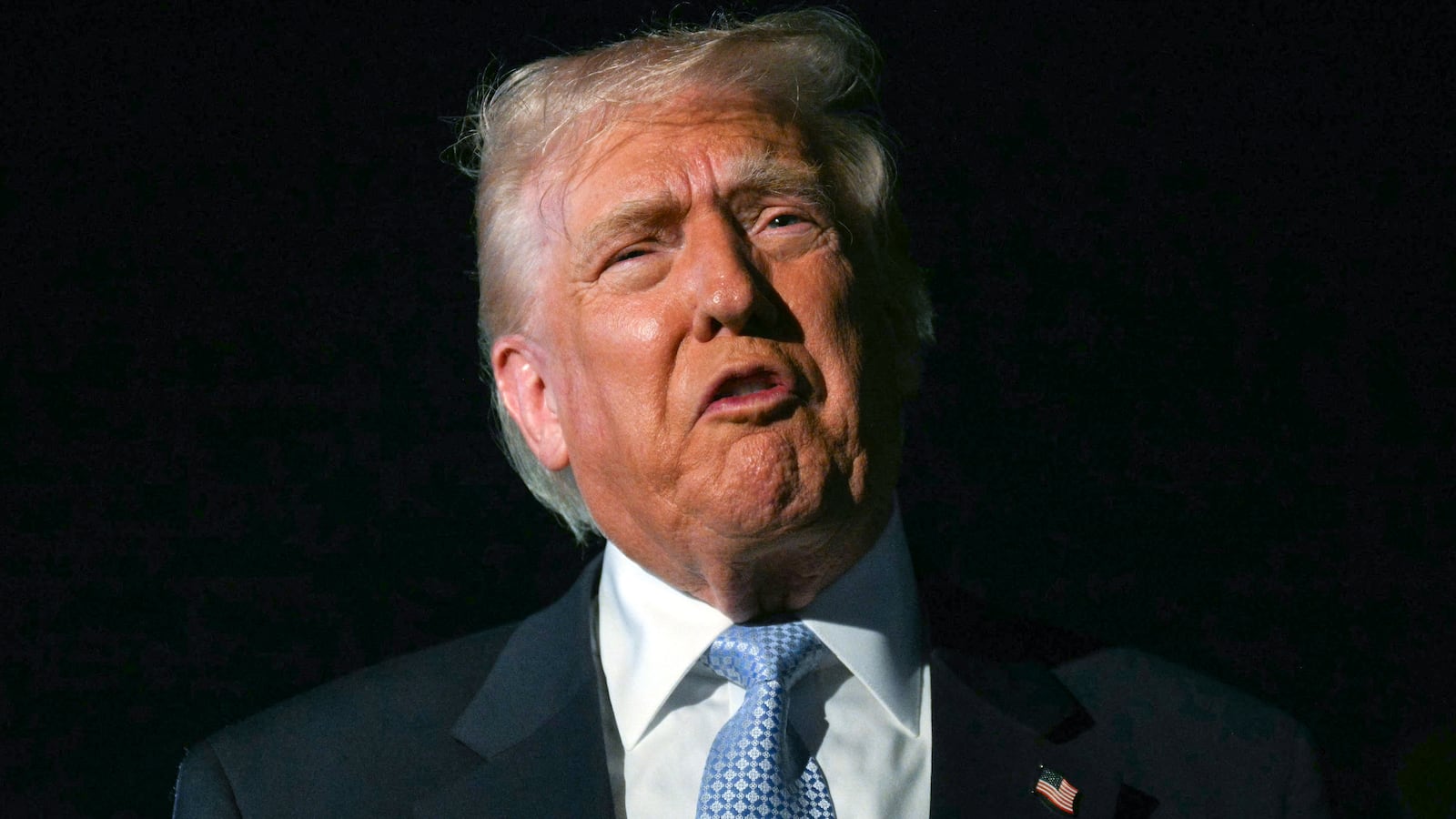 US President Donald Trump speaks with reporters before boarding Air Force One as he departs Palm Beach International Airport in West Palm Beach, Florida, on November 16, 2025. Trump is returning to the White House after spending the weekend at his Mar-a-Lago, Florida, residence.