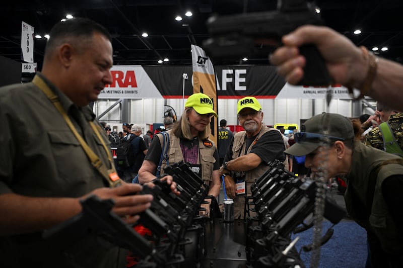 People attend the National Rifle Association’s (NRA) annual meetings and exhibits in Houston, Texas, U.S. April 18, 2026.