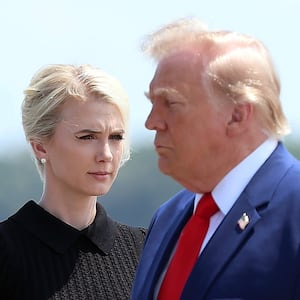DOVER, DELAWARE - JULY 22: Natalie Harp, executive assistant to U.S. President Donald Trump, stands as President Trump arrives for a dignified transfer at Dover Air Force Base for military casualties of the war with Iran on July 22, 2026 in Dover, Delaware. Trump attend the dignified transfer of of Army 1st Lt. Tyler James Feehan, Staff Sgt. Michael Emmanuel Swinton, Army Sgt. Angel S. Rampersad and Army Pvt. Isabella Gonzales. (Photo by Kevin Dietsch/Getty Images)