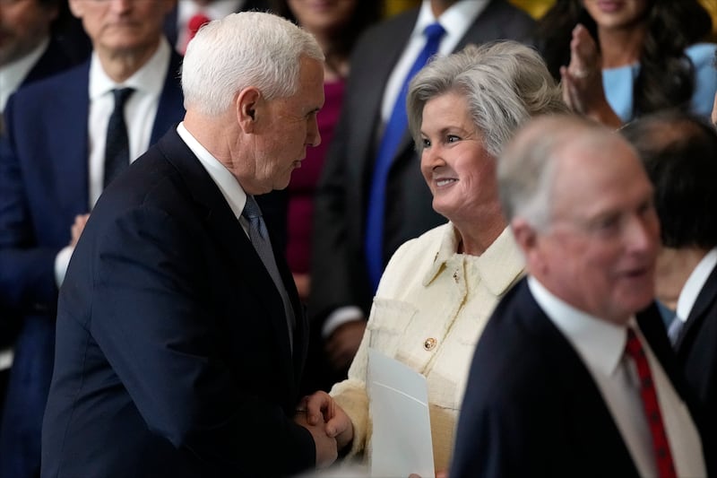Wiles greets Pence at Trump's inauguration last January.
