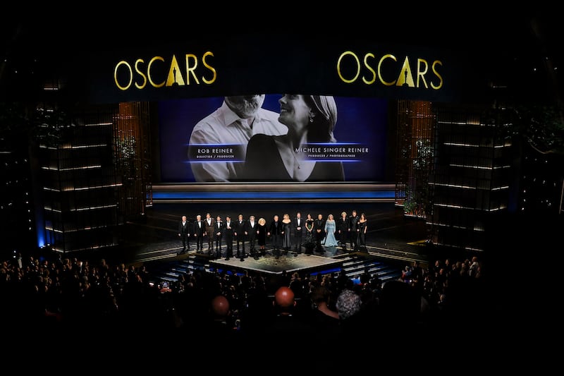 Michael McKean, Christopher Guest, Jerry O'Connell, Wil Wheaton, Fred Savage, Cary Elwes, Mandy Patinkin, Carol Kane, Billy Crystal, Meg Ryan, Kiefer Sutherland, Demi Moore, Kevin Pollak, Kathy Bates, Annette Bening, John Cusack and Daphne Zuniga onstage during a tribute for the late Rob Reiner and his wife Michele Singer Reiner during the In Memoriam segment at the Oscars show of the 98th Academy Awards in Hollywood, Los Angeles, California, on March 15, 2026.