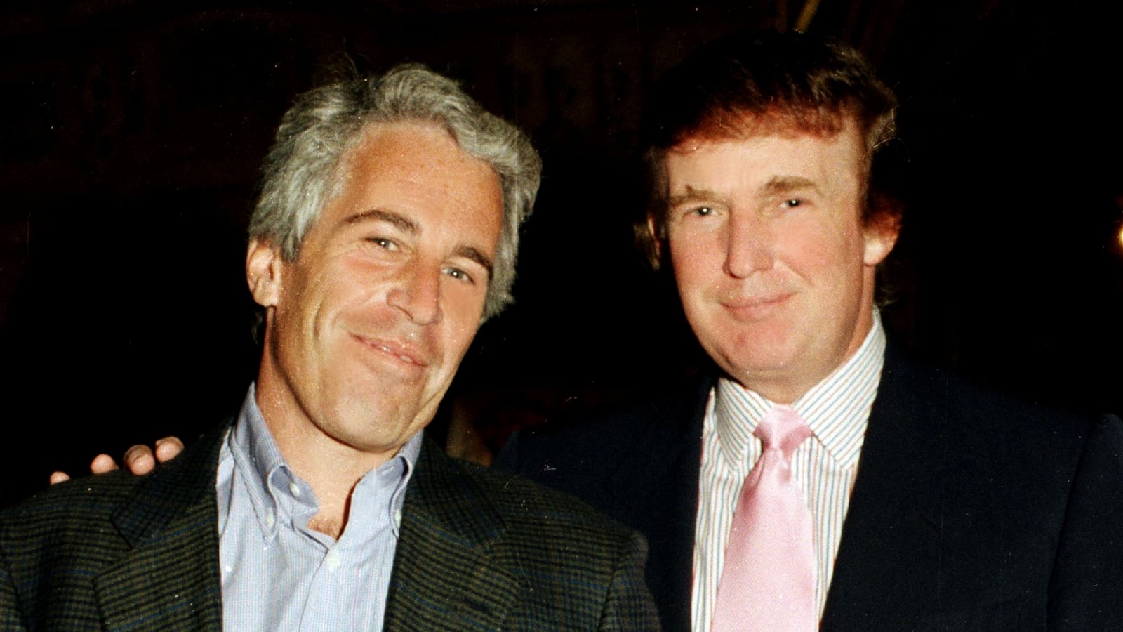 Portrait of American financier Jeffrey Epstein (left) and real estate developer Donald Trump as they pose together at the Mar-a-Lago estate, Palm Beach, Florida on February 22, 1997. (Photo by Davidoff Studios/Getty Images)