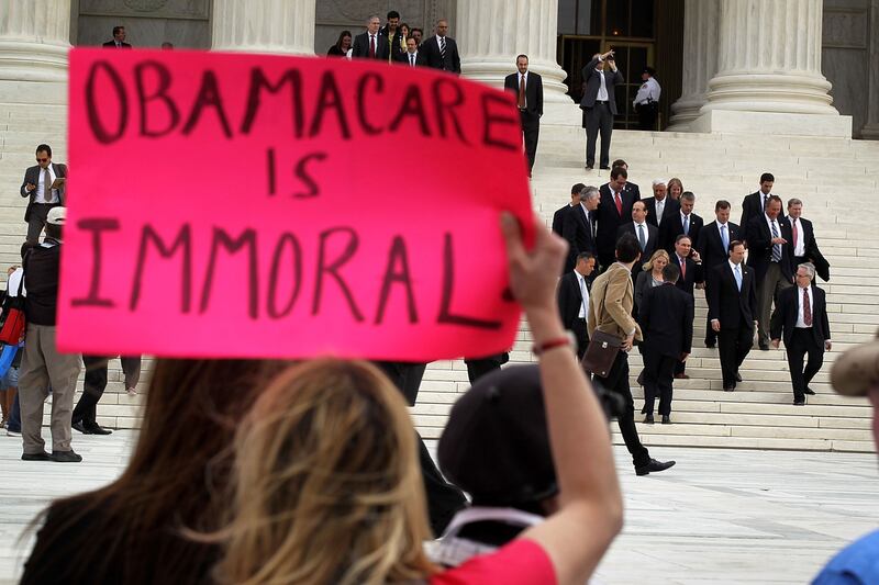 galleries/2012/06/27/most-divisive-supreme-court-decisions-obamacare-more-photos/controversial-scotus-obamacare_qnmrjt