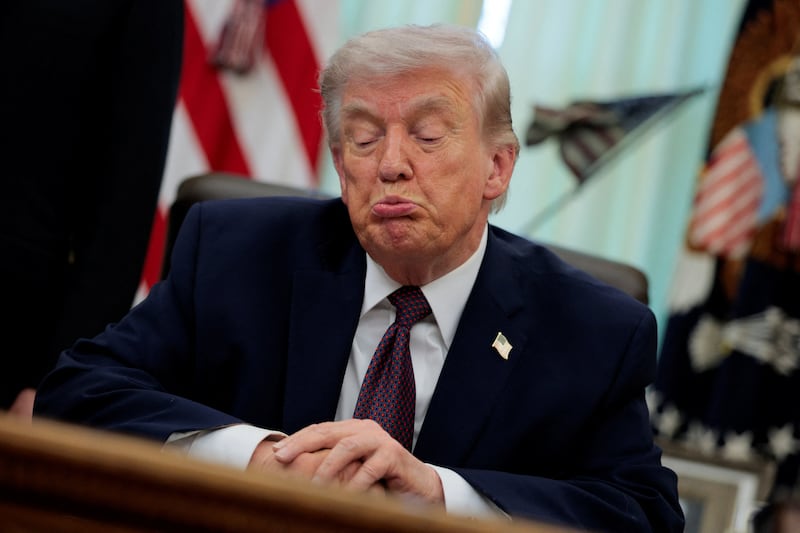U.S. President Donald Trump reacts as he speaks during the signing ceremony for an executive order on mail ballots, in the Oval Office of the White House in Washington, D.C.