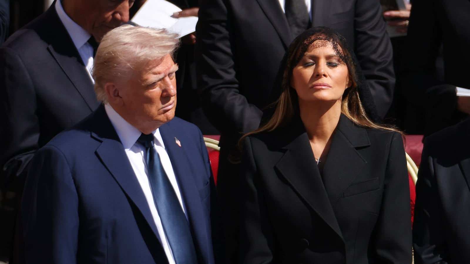 President Donald Trump and US First Lady Melania Trump standing before Pope Francis' funeral.